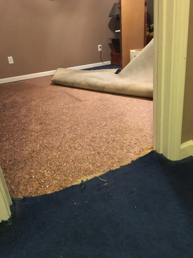 Carpet pad removal revealing water damage during Drying & Dehumidification in Chocolay